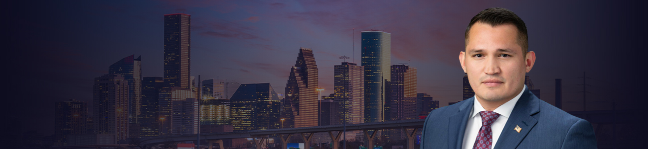 Picture of Art Aguilar with San Antonio buildings in the background